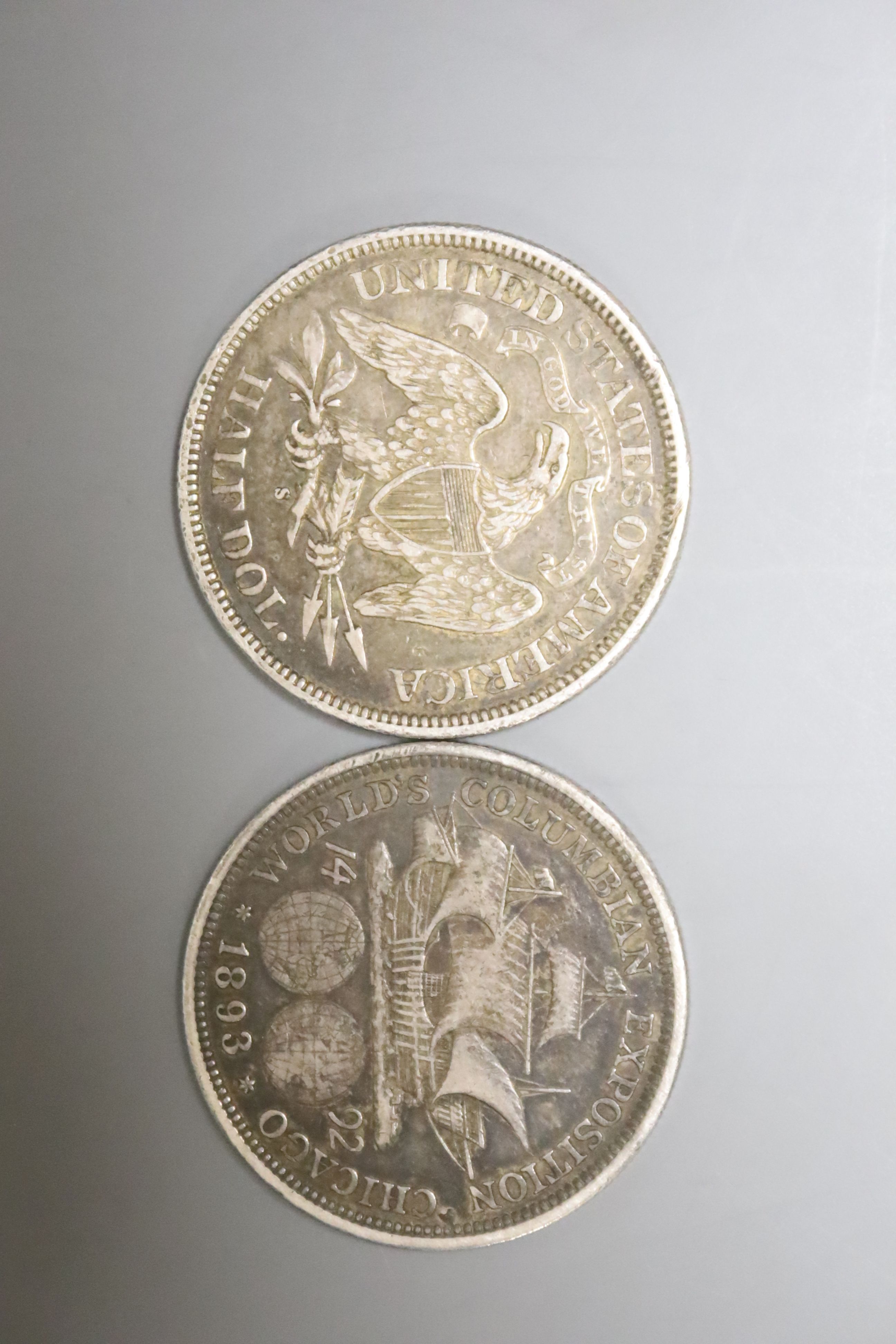 A US 50 cents 1876 and a Columbian Exhibition medal 1893